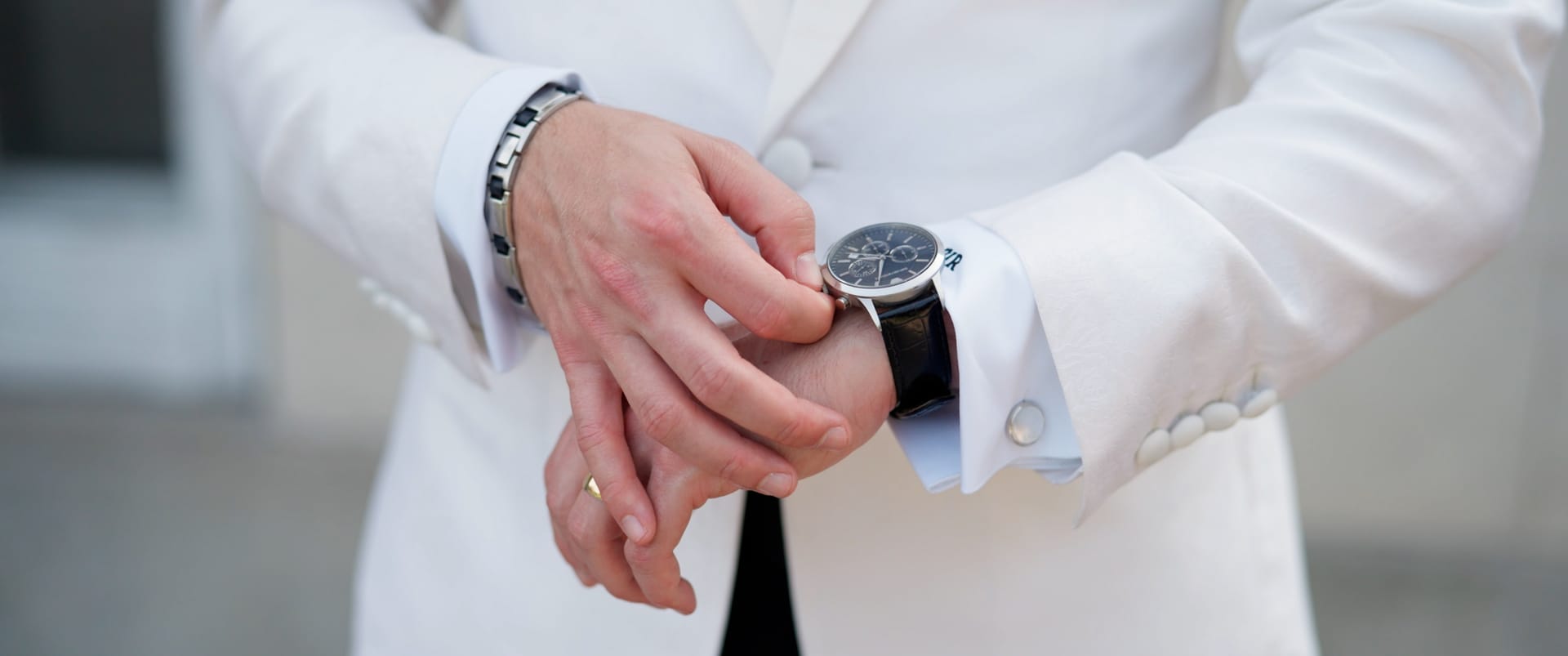 Groom adjusting his wristwatch before the ceremony — documentary wedding film