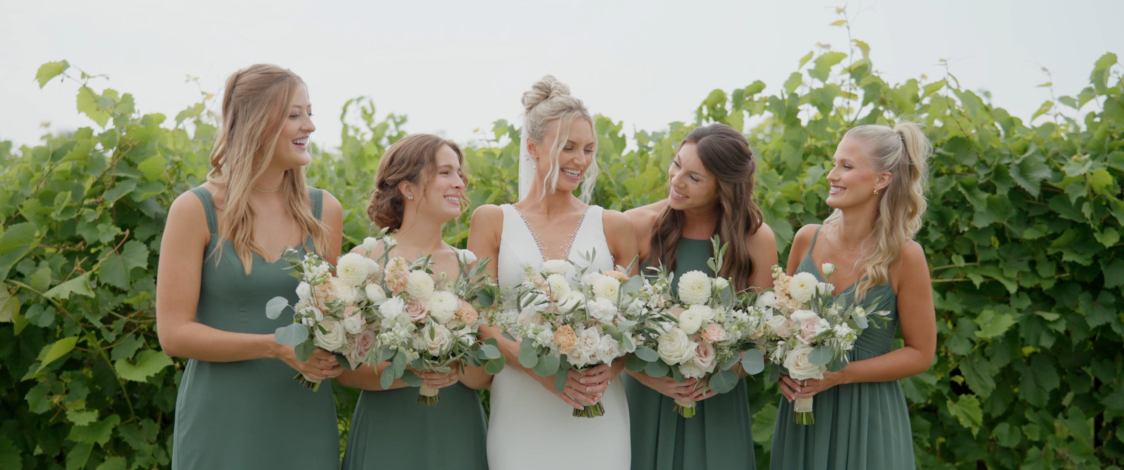 Bridesmaids in vineyard, warm light